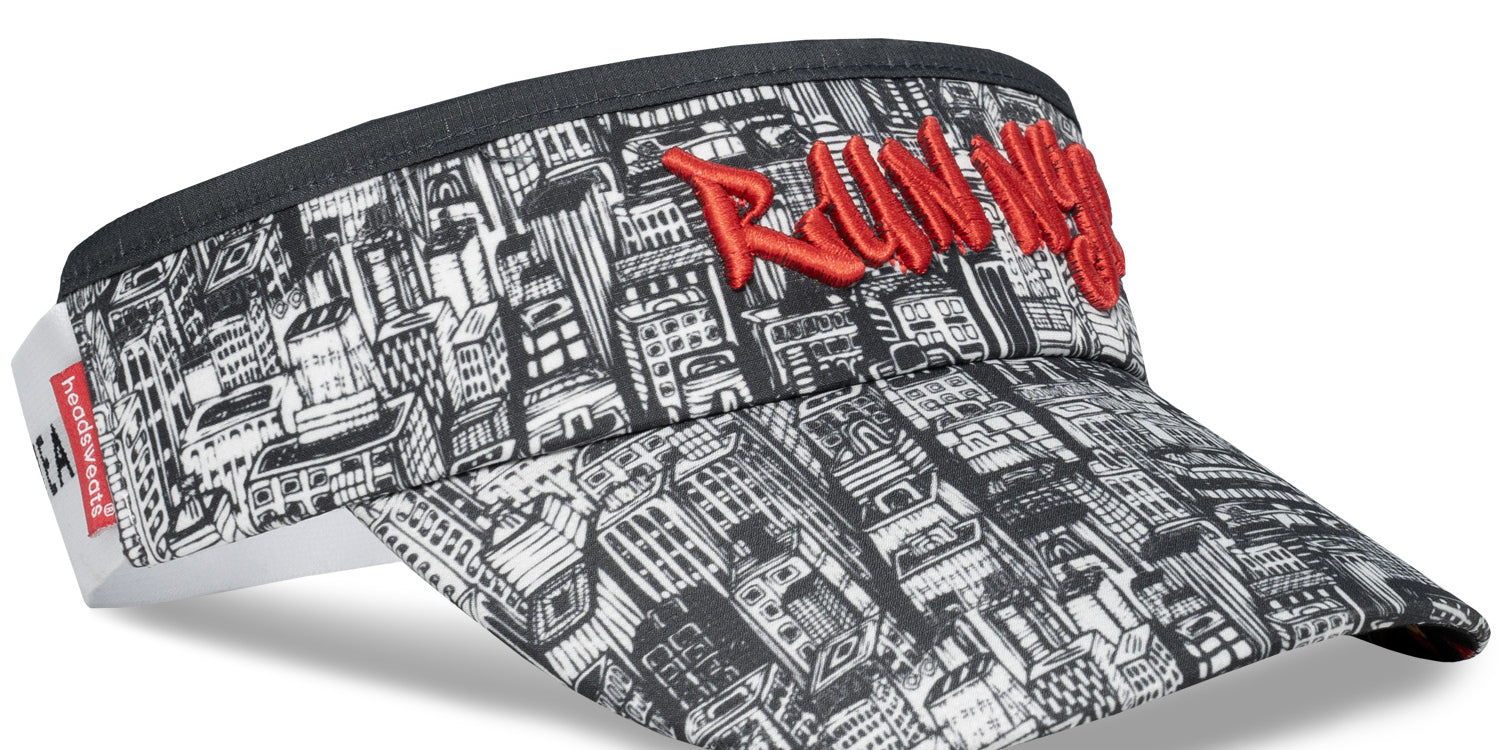 Headsweats NYC Running Visor featuring black and white New York cityscape print and red embroidered “Run NYC” logo on front panel.