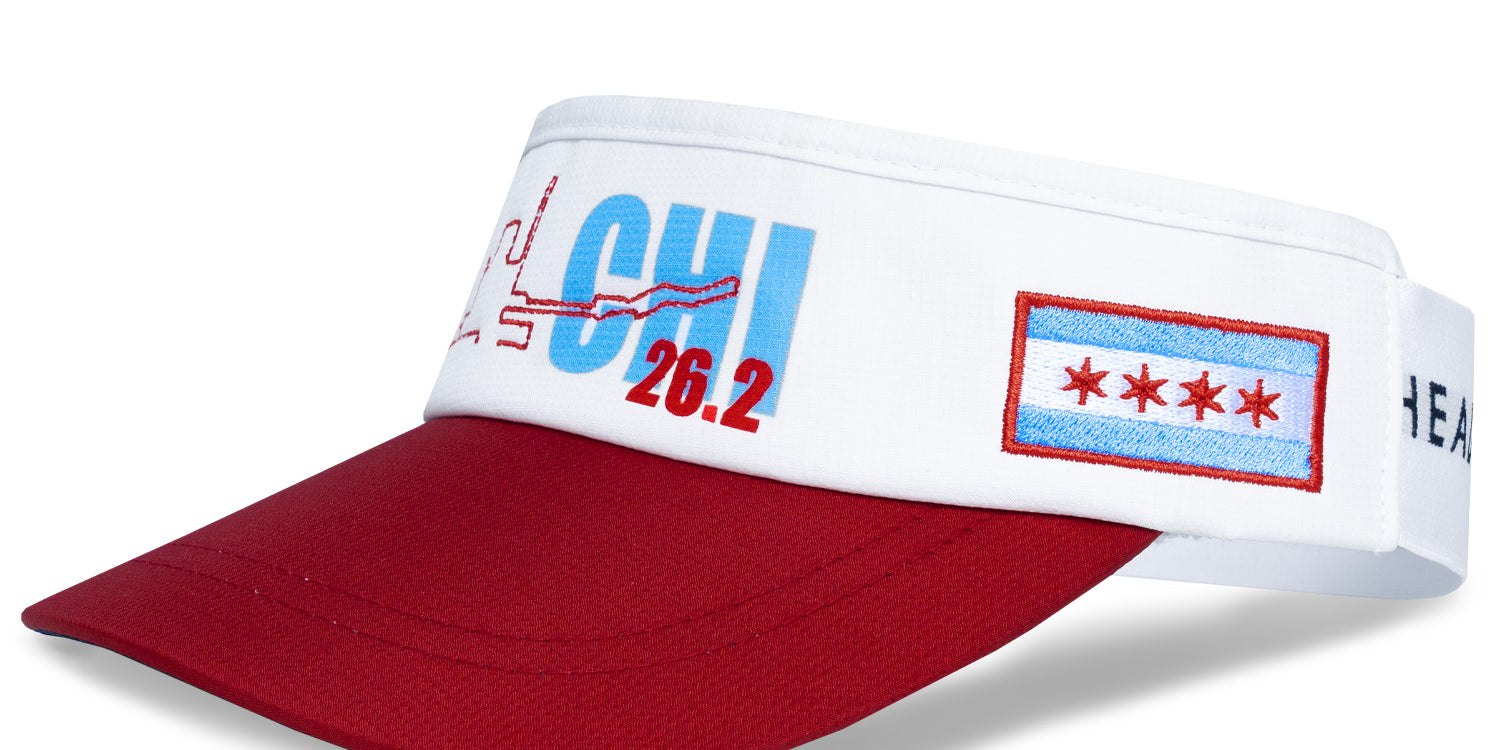Chicago 26.2 Running Visor by Headsweats with red bill, white band, “CHI 26.2” design, and embroidered Chicago city flag on the side.