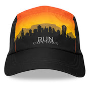 Front view of Run The World Cape Town 2026 performance running hat with sunset-inspired design